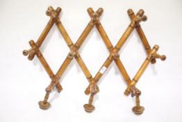 A Victorian bamboo effect X- frame expanding set of coat hooks (10)