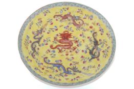 A 20th century Chinese yellow ground dragon dish.