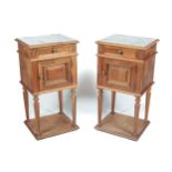 A pair of Louis XVI style French bedside cabinets.