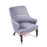 A late Victorian upholstered low armchair.