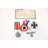 Military : A WWII German Iron Cross 2nd Class Hitler Youth badge and others.