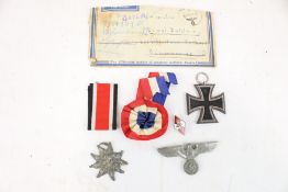 Military : A WWII German Iron Cross 2nd Class Hitler Youth badge and others.
