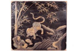 Japanese Meji laquered panel, signed. Showing a tiger near a gushing stream and bamboo etc.