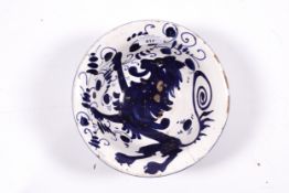 Delft : An 18th/19th century pottery bowl with lion passant decoration in dark blue and white