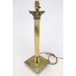 A contemporary brass Corinthian column table lamp.