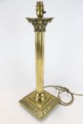 A contemporary brass Corinthian column table lamp.
