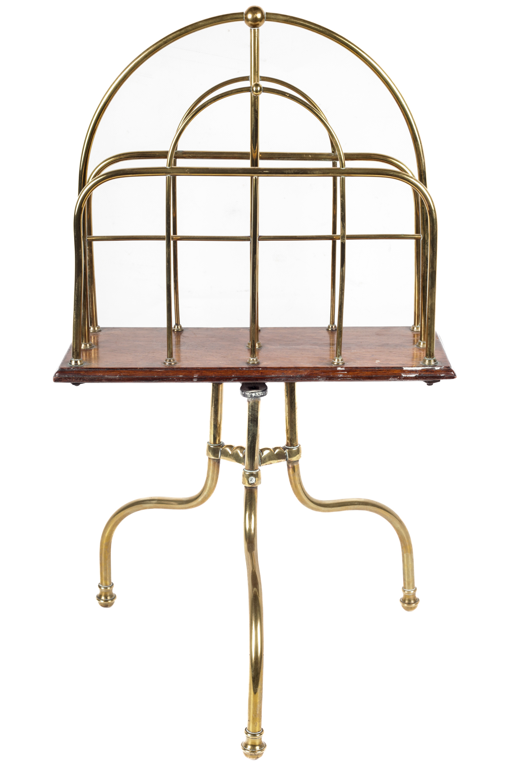 An Edwardian brass and oak tripod magazine rack.