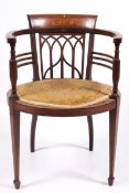An Edwardian inlaid (cornucopia to back panel, etc) oval shaped ribbed barrel open armchair.