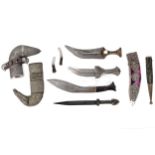 A quantity of assorted daggers from around the world to include a Decorative Kukri,