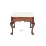 A George II oak pad foot drop-in over stuffed stool. 43.