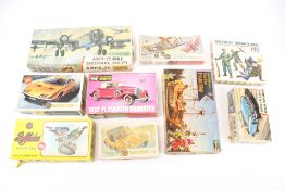 A collection of assorted vintage Airfix and other model vehicle kits.