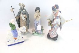 Three Lladro figures and a Rye Pottery figure.