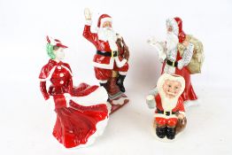 Four Royal Doulton Christmas related figures.