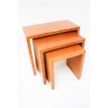 A contemporary nest of three wooden tables. Rectangular in form, Max. L60cm x D30cm x H53.