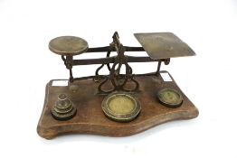 A vintage set of postage letter scales with weights.