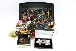 An assortment of costume jewellery. Including bangles, necklaces, bracelets, etc.