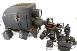 A collection of assorted vintage camera equipment.