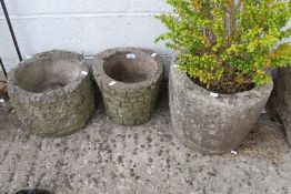 Three assorted circular stone garden planters. Max.