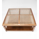 A contemporary square cane top coffee table.