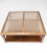 A contemporary square cane top coffee table.