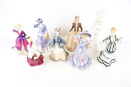 Eight ceramic figures of ladies.