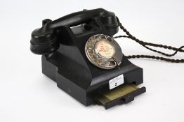 A vintage GPO bakelite rotary dial telephone. #332CB with drawer, Wells 3622.
