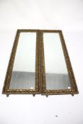 A pair of 20th century wall mirrors.