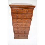 An Edwardian oak chest of multi drawers.