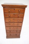 An Edwardian oak chest of multi drawers.