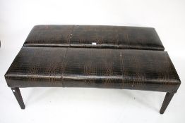 A pair of faux crocodile skin stools.