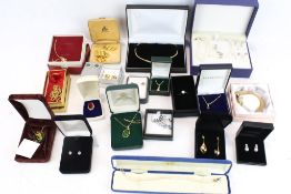 An assortment of boxed costume jewellery. Including pairs of earrings, a bracelet, ring, etc.
