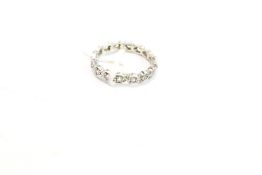 A 9ct white gold and gem set eternity ring. size M, 2.
