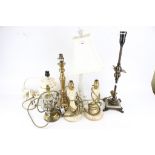 A group of seven assorted table lamps.