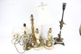 A group of seven assorted table lamps.