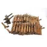 A collection of assorted vintage wooden carpentry tools.