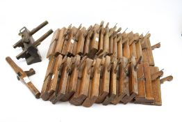 A collection of assorted vintage wooden carpentry tools.