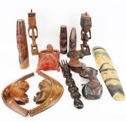 A collection of assorted carved African tribal items. Including ornaments, masks, etc. Max.