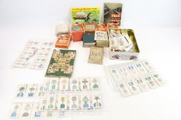 A collection of assorted vintage playing and trading cards.