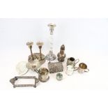 A collection of EPNS. Including a pair of candlesticks, sugar shaker, cream jug, etc.