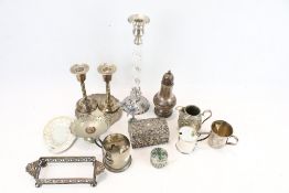 A collection of EPNS. Including a pair of candlesticks, sugar shaker, cream jug, etc.