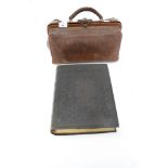 A vintage brown leather Doctor's bag plus a large leather bound Bible.