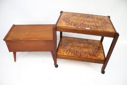 A Mid-century tile top tea trolley and a sewing work box.