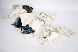 A collection of assorted vintage linen and lace work. In two boxes including table clothes, etc.