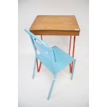 A vintage Tri-ang childs school desk and a chair.