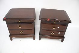A pair of contemporary Stag bedside cabinets.