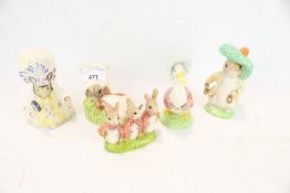 Five Beatrix Potter character figures.