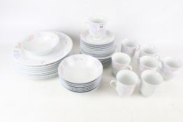 A contemporary dinner and tea service. 'Prestige' by Excel, including eight cups and saucers, etc.