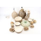 A collection of studio pottery. Including three lamp bases, a clock, candlesticks, etc.