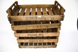A stack of five wooden fruit crates. Including three 'Robinson Bros.', etc.
