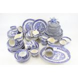 A collection of 'Old Willow' pattern tea and dinner services.